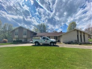 Van Martin Roofing performing a free roof inspection.